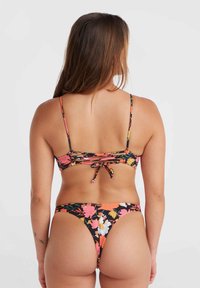 Set bikini floreale con sfondo nero e fiori vivaci in rosa, arancione e giallo. Spalline sottili e dettaglio con fiocco sul retro.