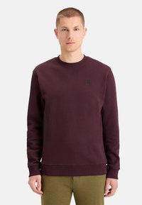 Bordeaux crew-neck sweatshirts med ribbede manchetter og kant, med et lille firkantet logo på brystet. Blødt stof og afslappet pasform.