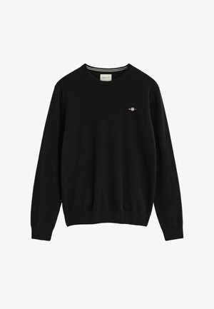 Black knitted sweater with a crew neckline, features a small embroidered logo on the left chest, ribbed cuffs, and hem.