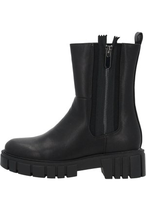 Bottines en cuir noir avec une semelle épaisse, dotées de doubles zips sur les côtés et de panneaux élastiques côtelés. Texture lisse et design moderne.