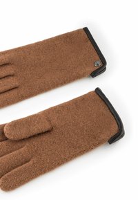 Guantes de lana marrones con un acabado texturizado, que presentan un acento de cuero negro en el puño y un detalle de logo metálico redondo.