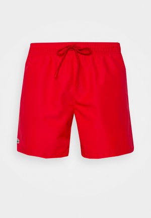 Rote Badehose aus glattem, leichtem Material mit elastischem Bund und Kordelzug. Mit einem kleinen Logo-Detail an der Seite.