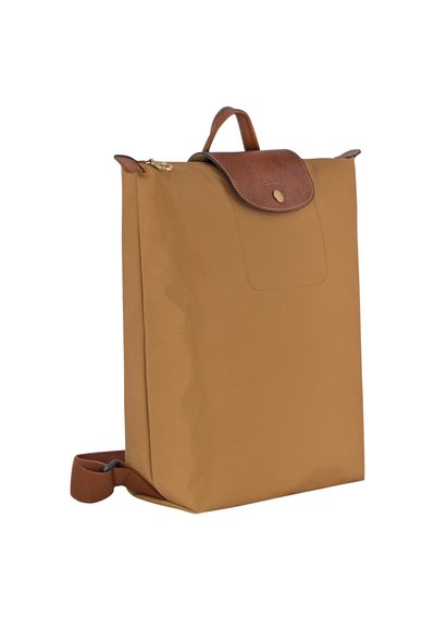 Brown nylon bag with a structured, rectangular shape, featuring a textured brown leather flap, gold hardware, and adjustable fabric strap.
