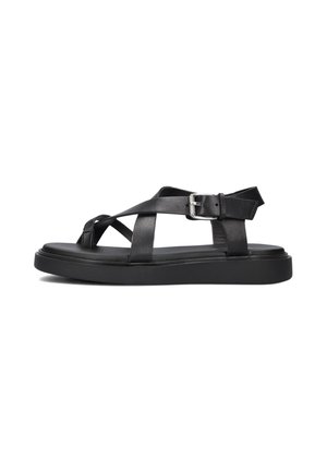 Black leather sandal featuring cross straps and a buckle closure, set against a white background, highlighting its minimalist design.