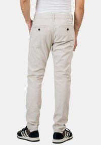 Reell FLEX TAPERED - Pantalones chinos - oatmeal