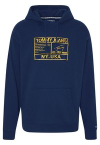 Tmavě modrá mikina s kapucí z bavlněné směsi, vybavená přední kapsou kangaroo, stahovací šňůrkou na kapuci a žlutým vyšívaným logem.