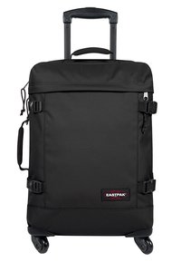 Black wheeled suitcase with retractable handle, made of durable fabric, featuring two side straps, a zippered compartment, and a branded patch.