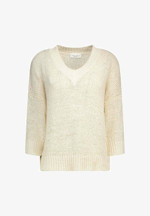Pull en grosse maille couleur crème avec col en V et manches trois-quarts, avec poignets et ourlet côtelés.