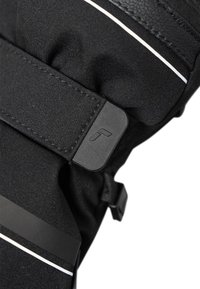 Gant en textile noir avec une texture lisse, une sangle Velcro et un accent en caoutchouc avec un logo. Design slim avec un détail de bande réfléchissante.