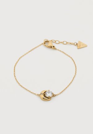 Zarter Armband aus Goldkette mit einem Halbmondanhänger, der einen runden klaren Edelstein hält, sowie kleinen Stern-Details, verstellbarer Verschluss mit dreieckigem Anhänger.