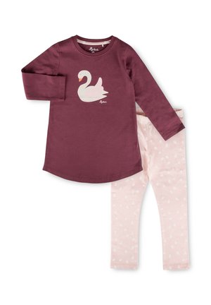 Langärmliges dunkelviolettes Oberteil mit weißem Schwanenmotiv, kombiniert mit hellrosa Leggings mit weißen Punkten.