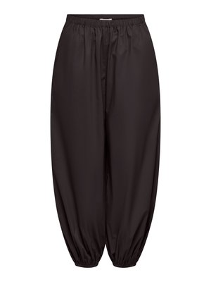Pantalon noir ample avec taille élastique et poignets élastiques froncés aux chevilles.
