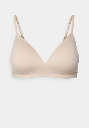 Bralette sem fios bege com um design em V, textura suave e alças ajustáveis. Feito de material macio e elástico para maior conforto.