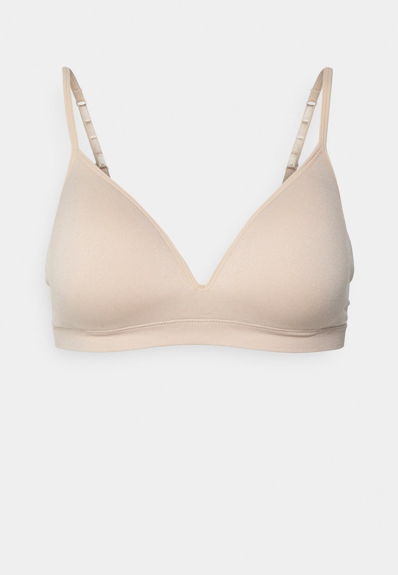 Beig színű vezeték nélküli bralette V-nyakú dizájnnal, sima textúrával és állítható pántokkal. Puha, rugalmas anyagból készült a kényelem érdekében.