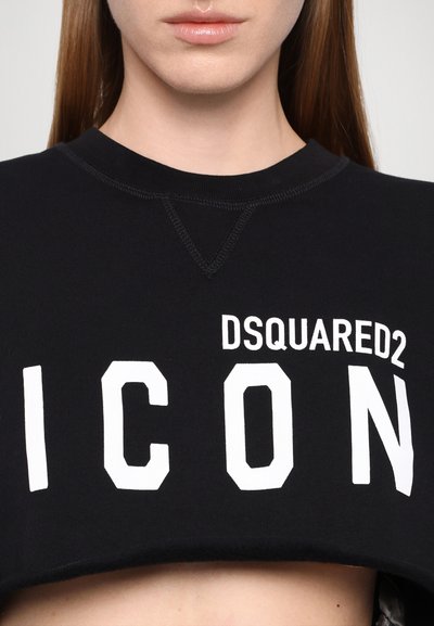 Čierna skrátená mikina vyrobená z bavlny, s výrazným bielym textom: "DSQUARED2 ICON." Obsahuje okrúhly výstrih a viditeľné švy.