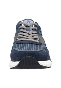 Navy blue sneakers with suede and striped fabric, grey laces, and a contrasting white sole. Features a textured black rubber outsole.