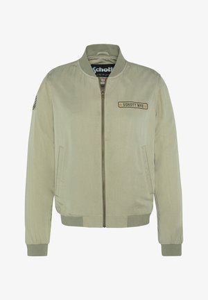 Veste bomber vert olive en tissu doux, avec fermeture éclair à l'avant, poignets côtelés et un patch logo sur la poitrine. Deux poches latérales.