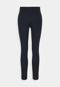 Zwarte legging met een strakke, rekbare pasvorm. Gladde textuur, hoge taille en geen zichtbare patronen of hardware. Eenvoudig en veelzijdig.