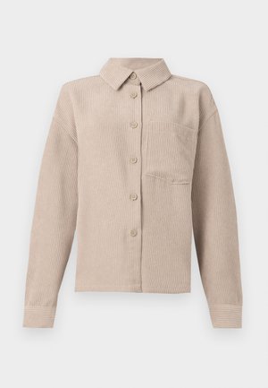 Beige corduroy shirt jacket featuring a collar, five-button closure, and a single chest pocket. Soft texture with vertical ribbing.