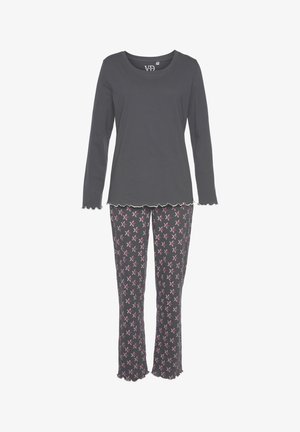 Graues Langarmshirt mit gewelltem Saum, kombiniert mit gemusterten Schlafanzughosen, die rosa-weiße Sternenmuster auf dunklem Hintergrund haben.