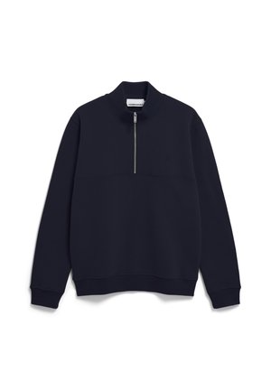 Pullover nero a maniche lunghe con zip a quarti, polsini a coste e colletto rialzato, posato su uno sfondo bianco.