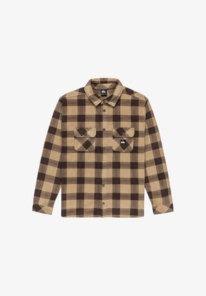 Camisa de franela marrón y beige con un patrón a cuadros, que presenta un frente abotonado, dos bolsillos en el pecho y un cuello con solapa.