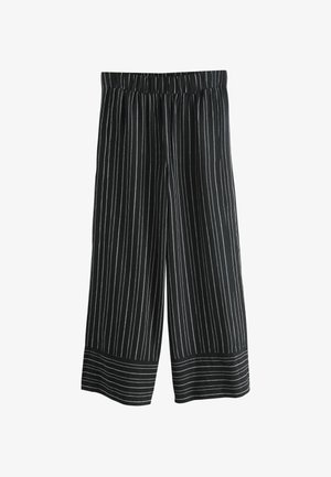 Sort-hvide stribede culotter med elastisk taljebånd, vide ben og en glat tekstur. Stoffet virker let og åndbart.