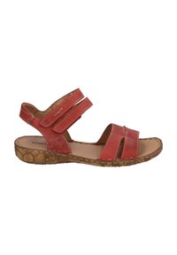 Red leather sandal with two adjustable straps, open toe design, and cork-like sole. Notable stitching detail along straps and sole edge.
