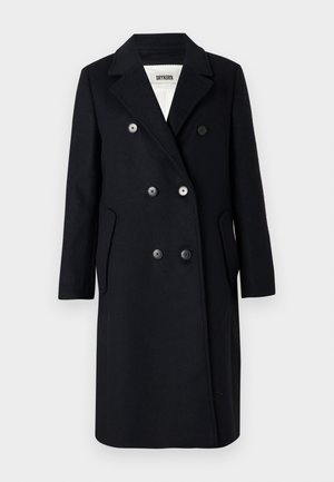 Zwart dubbelzijdig wollen jasje met notched lapels, zes knopen, zijzakken en een witte voering met het merklabel Drykorn.
