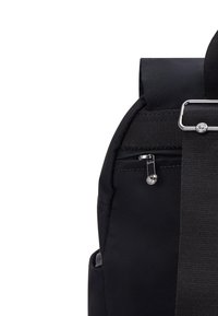 Black backpack featuring a smooth fabric, a zippered pocket, and a wide strap with a metallic buckle detail. Compact design and durable material.
