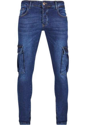 Denim cargo pants in dark blue with a fitted design, featuring side cargo pockets and a faded texture on the fabric.