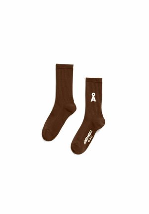 Paar braune gerippte Socken, eine zeigt weißes Logo "A" am Knöchel und den Text "AMENAPELS EU 39-42" am Fuß.