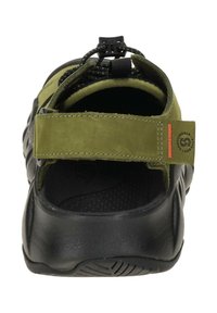 Green suede upper with black rubber sole. Features adjustable strap and textured inner lining. Rear pull loop for easy wear.
