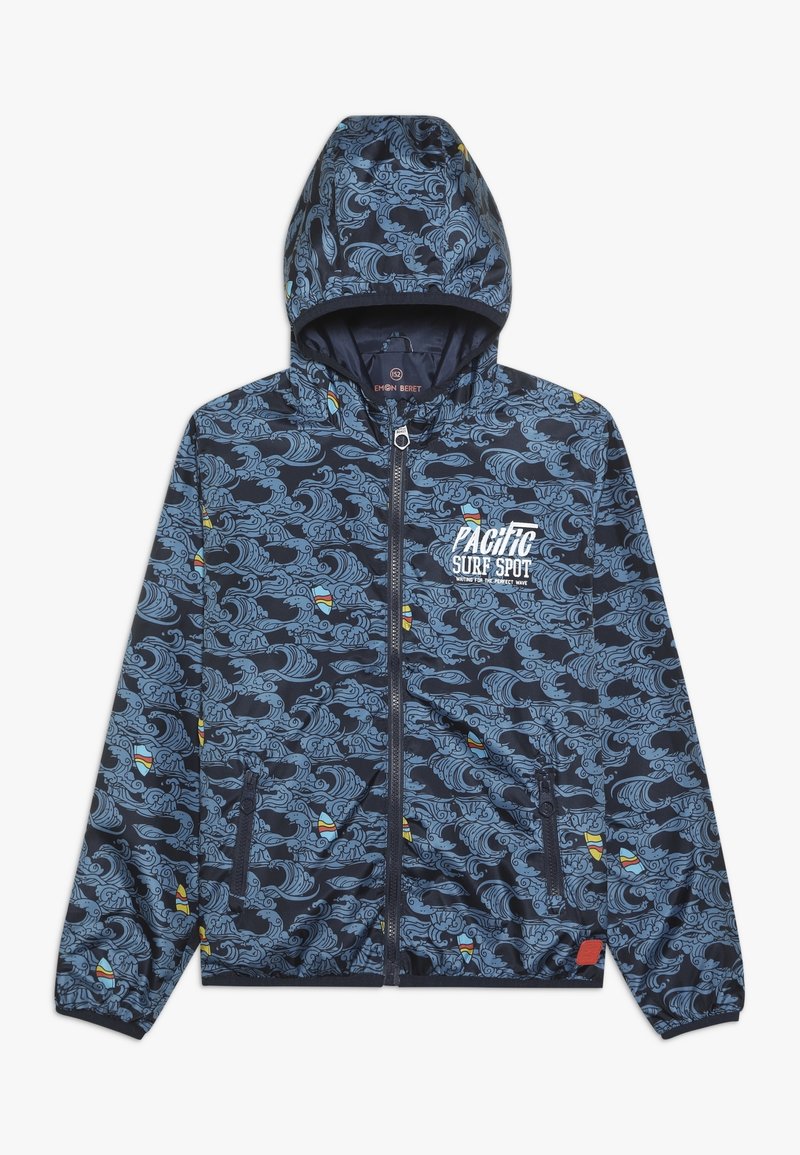 Marineblaue Kapuzenjacke mit Wellen- und Surfbrettmuster, vorderem Reißverschluss, Reißverschlusstaschen und weißem Text "Pacific Surf Spot" auf der Brust.