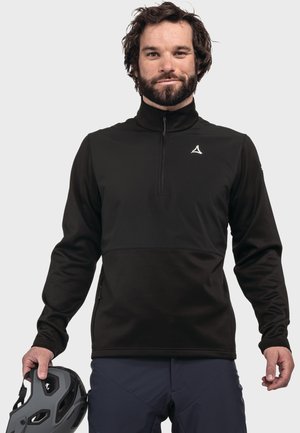 Schwarzer Fleece-Pullover mit einem Viertel-Reißverschluss-Kragen, ausgestattet mit einem kontrastierenden Brustpaneel, seitlichen Reißverschlüssen und einem Logo auf der linken Brust.