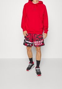 Mitchell & Ness Pantalón corto de deporte - black