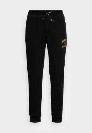 TROUSER - Träningsbyxor - black/gold