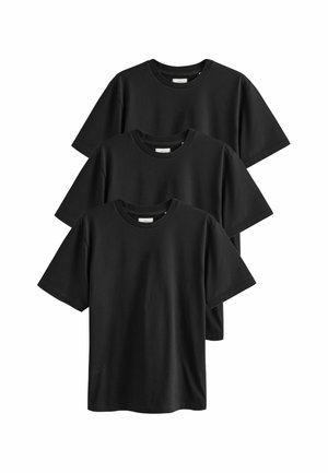 Tres camisetas de algodón negras apiladas. Cada una tiene un cuello redondo y mangas cortas, con un diseño simple y limpio sin patrones visibles.