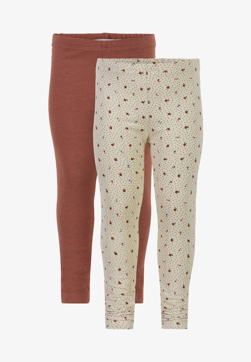 Dve para leggingov: ena v rjavi bombažni barvi, druga v kremni barvi s cvetličnim in pikčastim vzorcem. Obe imata elastičen pas.