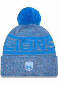 Blau-graue Strickmütze mit einem Pom-Pom, ausgestattet mit geprägtem "LIONS"-Text und einem NFL-Logo-Patch am Bund.