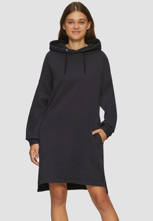 Robe sweat à capuche en bleu marine foncé. Elle présente des manches longues, des poches latérales et une coupe décontractée avec un ourlet légèrement arrondi. Tissu doux.