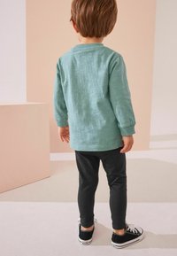 Next LONG SLEEVE SET - REGULAR FIT - Tepláková súprava - green dinosaur