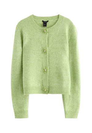 Cardigan verde realizzato in morbido tessuto a maglia. Presenta una scollatura tonda, maniche lunghe e bottoni floreali per la chiusura. Design corto.