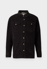 Schwarze Kordstoff-Hemdjacke mit Knopfleiste, zwei Brusttaschen und metallischen Knopfakzenten. Sie verfügt über einen klassischen Kragen und lange Ärmel.