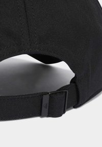 Black cotton cap with a textured surface, featuring an adjustable strap and a metal clasp at the back for secure fitting.