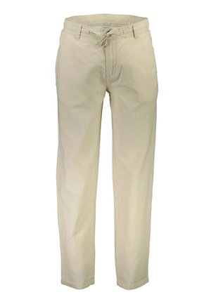 Beige linen pants with a relaxed fit, elastic waistband, and drawstring closure. Smooth texture with straight legs and rolled cuffs.
