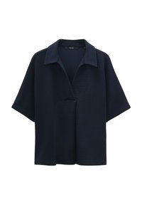 Haut à manches courtes navy avec col en V, en tissu texturé, présentant une coupe décontractée et un design avant asymétrique.