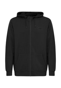 Svart zip-up hettegenser laget av mykt stoff. Har kengurulomme, snorer på hetten og en liten logo på brystet.