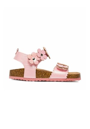 Sandalo rosa da bambino con suola in sughero, due cinturini a forma di fiore con borchie metalliche e bordi smerlati sulla fascia frontale.