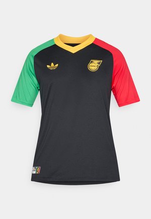 Czarny strój piłkarski z zielonymi i czerwonymi rękawami, żółtym kołnierzem w serek oraz złotymi akcentami. Posiada logo Jamajki oraz znak Adidas.